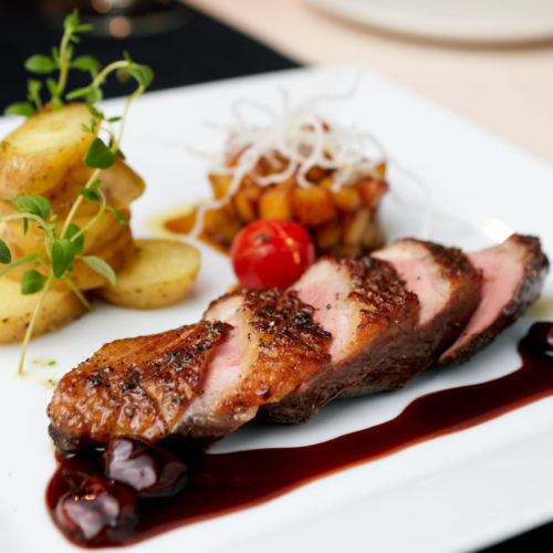 Roasted duck with pear,marinated in red wine and mascarpone rose